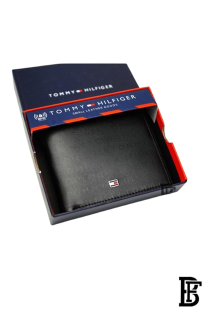 Tommy Hilfiger Wallet is a one to face solid style covered in light/black leather image 0