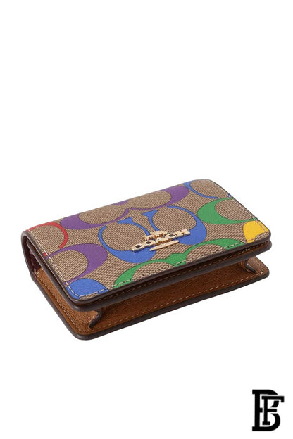 Coach billfold or snap wallet in rainbow signature canvas and refined leather. image 1