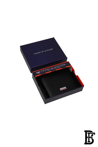Tommy Hilfiger Wallet is a one to face solid style covered in light/black leather image 1