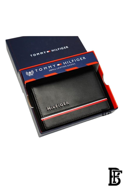 Tommy Hilfiger wallet is a one to face solid style covered in light/black leather image 1