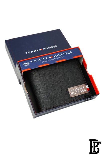 Tommy Hilfiger Wallet is a one to face solid style covered in light/black leather image 0
