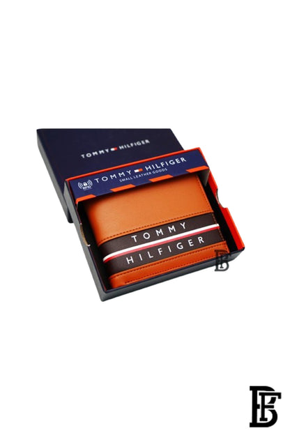Tommy Hilfiger Wallet  is a one to face solid style covered in light/BROWN leather image 0