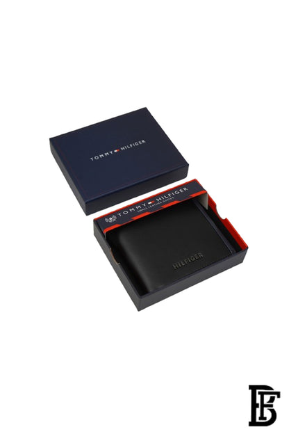 Tommy Hilfiger Wallet  is a one to face solid style covered in light/black leather image 0